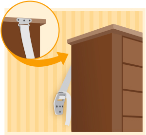 Furniture anchored to the wall with anti-tip restraint straps