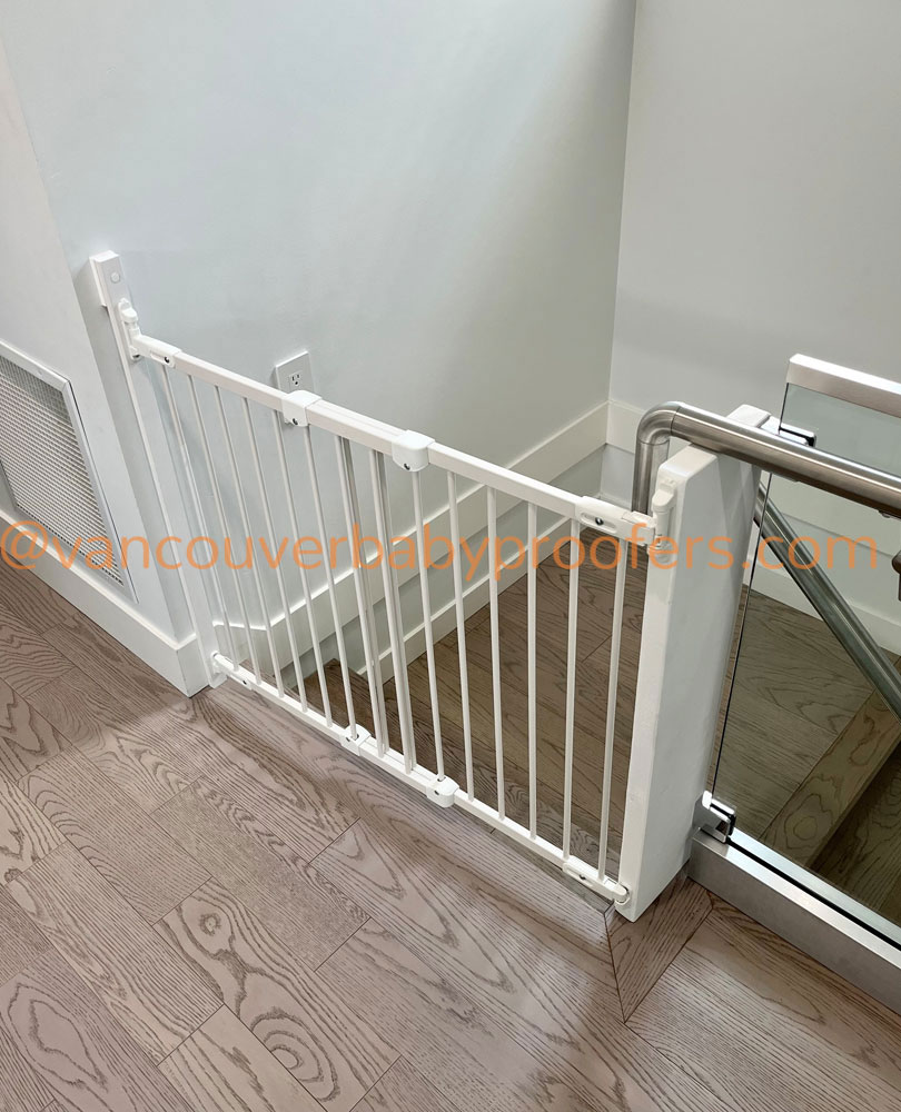 Wood banisters & no-hole clamps installation by Vancouver Baby Proofers