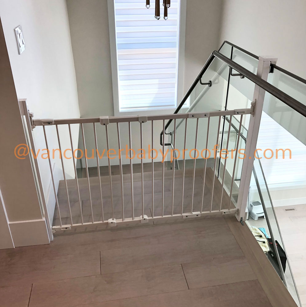Wood banisters & no-hole clamps installation by Vancouver Baby Proofers